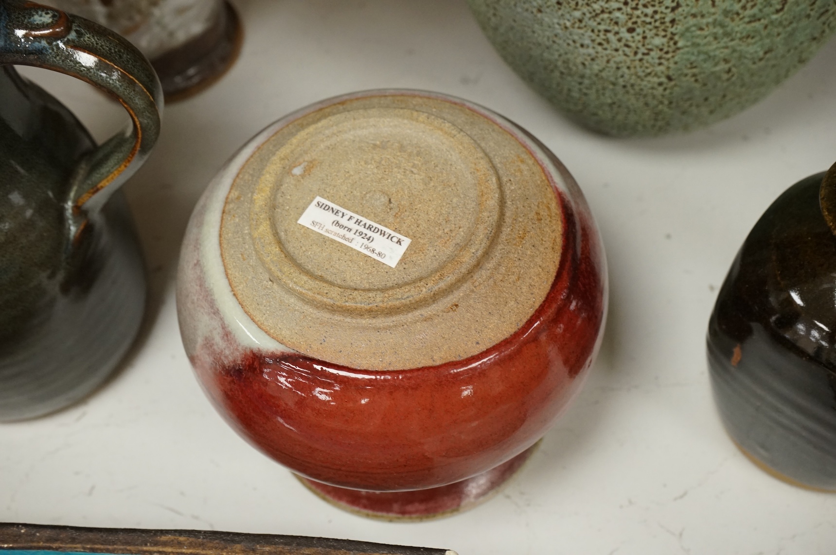 A group of eleven pieces of mixed 1960's-80's pottery to include vases, jugs and two rectangular dishes, largest 34cm high